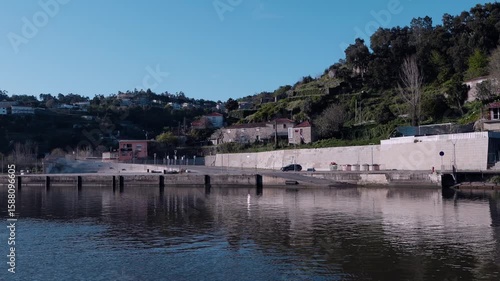 Wallpaper Mural calm view of a riverside quay with hillside homes along the douro river in portugal Torontodigital.ca