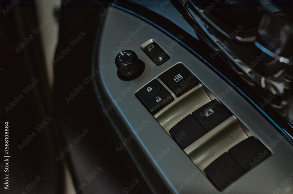 Fototapeta premium Car Door Control Panel with Buttons for Locks and Windows