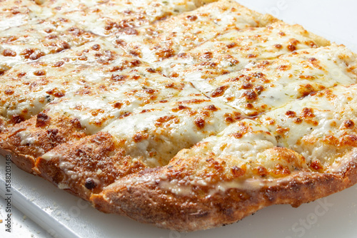 Tableau sur toile A view of cheesy garlic bread.