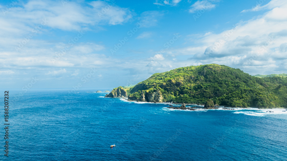 Fototapeta premium Lush Island Headland Meets Blue Ocean 