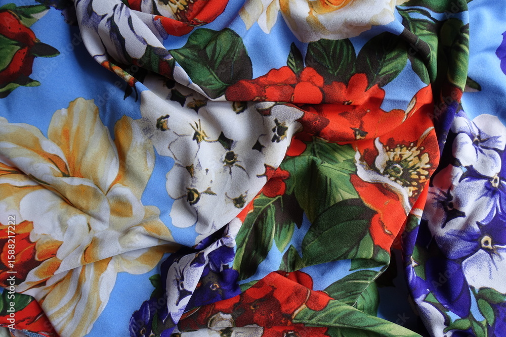 Fototapeta premium Soft folds on bright and colorful thin rayon fabric