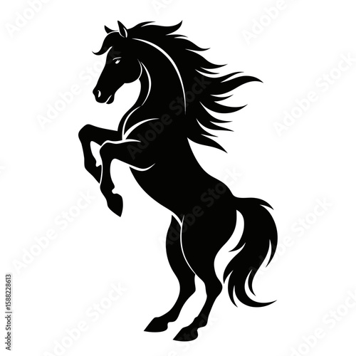 Powerful black silhouette of a rearing horse with flowing mane and tail