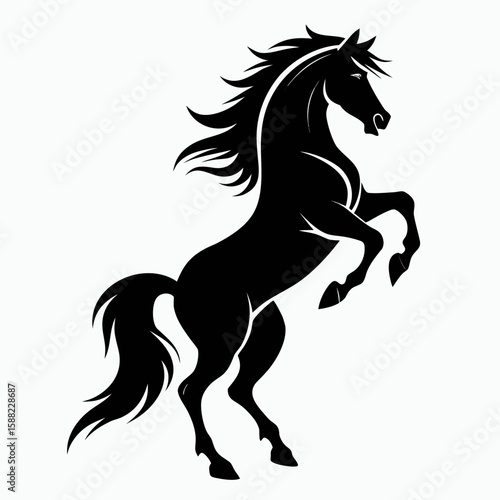 Powerful black horse rearing up on hind legs with flowing mane and tail