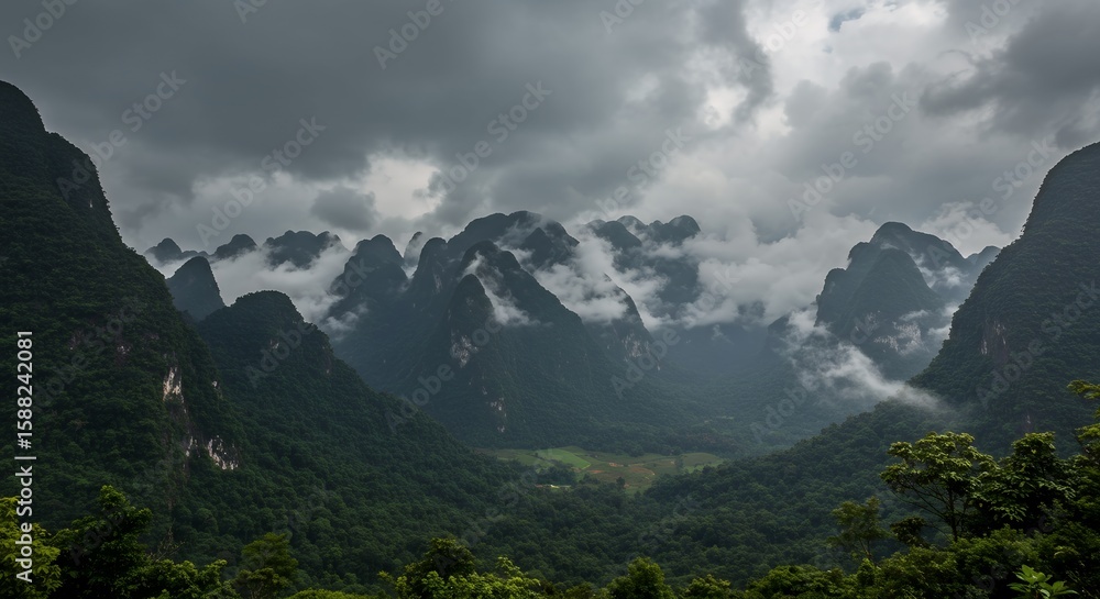 Fototapeta premium Monsoon clouds rolling over Hin Nam No mountain range