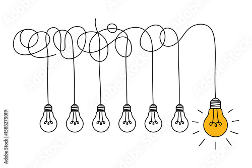 Single glowing yellow light bulb among unlit bulbs