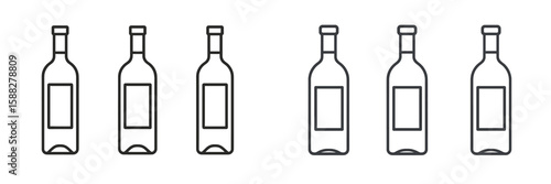 Variety of empty wine bottles lined up on a shelf in a minimalist presentation