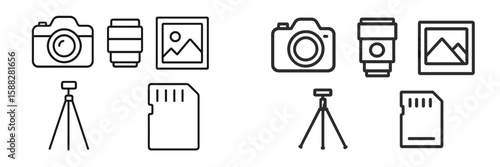 Collection of photography equipment including cameras, lenses, tripods, and memory cards displayed on a clean surface