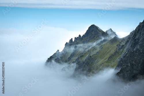Mountain peak above the clouds, mountain landscape.
