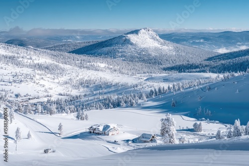 Snowy mountain valley with ski resort