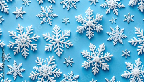Seamless Winter Pattern, Flat-Lay of Snowflakes and Ice Crystals on Blue Background Depicting the Serenity of the Holiday Season