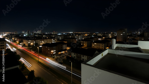 Wallpaper Mural Building Long-exposure rooftop scene capturing light trails from passing cars below Torontodigital.ca