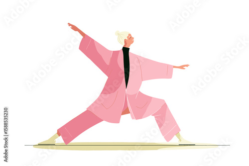 Senior woman practicing tai chi in pink outfit indoors at wellness retreat  