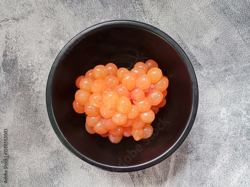 Raw catfish eggs. Sea catfish roe. Sea catfish eggs in a bowl. Fresh fish eggs for cooking.