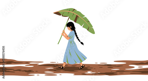 Young girl walks through mud, shielded by a large banana leaf umbrella.
