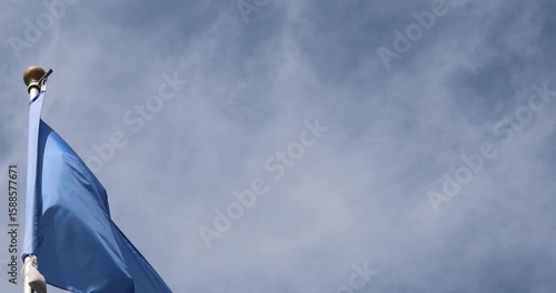 The Somali flag is captured in close-up. The Somali flag fluttering against the blue sky is the national symbol of Somalia. Great for news. The video is presented in 4K format.