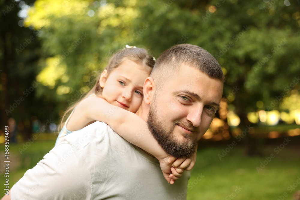 Happy Father's Day. Dad and his little daughter spending time together in park Happy Father's Day. Dad and his little daughter spending time together in park