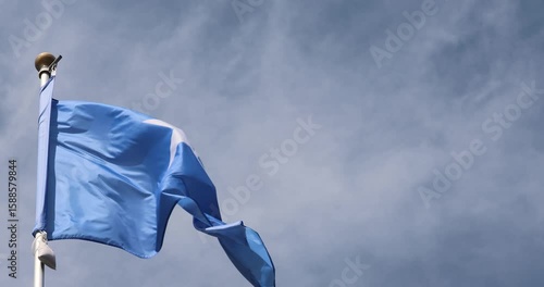 The Somali flag is captured in close-up. The Somali flag fluttering against the blue sky is the national symbol of Somalia. Great for news. The video is presented in 4K format.