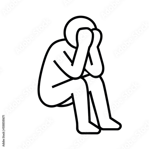 Seated figure in despair covering face in sadness and distress