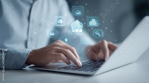 Man using a laptop with futuristic holographic icons representing smart home technology and data analysis