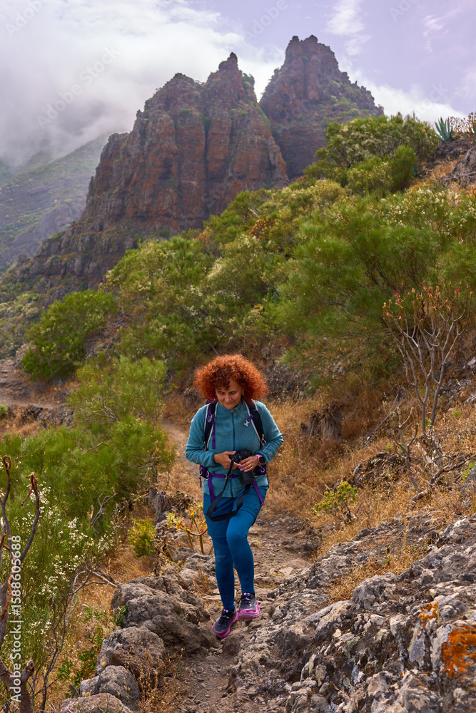 Fototapeta premium Hiker on mountain trail in Teno