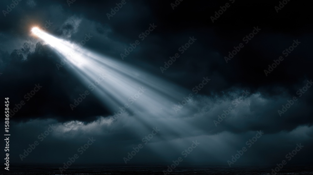 Obraz premium Light beam pierces dark clouds