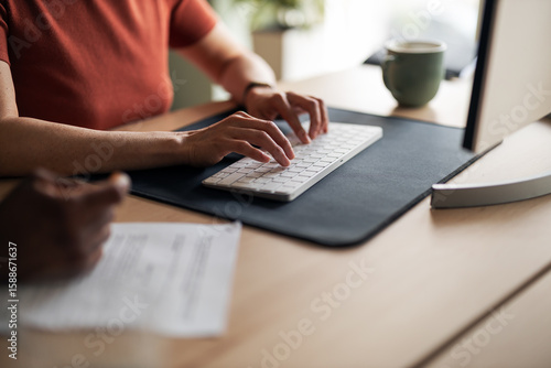 Wallpaper Mural Close-Up of Hands Typing at Work Desk Torontodigital.ca