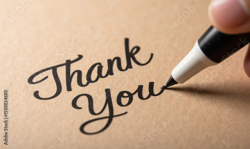Thank you note written with marker on brown paper, expressing gratitude and appreciation. elegant script adds personal touch to message
