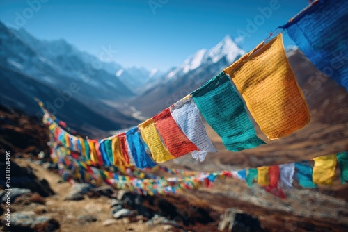 Colorful prayer flags strung high in mountain valley