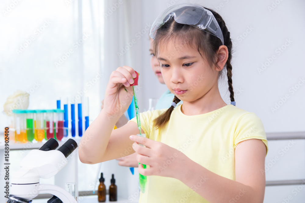 Science, education, experiment, chemistry, classroom learning in a modern setup with kids performing research on food samples and observing materials under microscope, academic interaction in action Science, education, experiment, chemistry, classroom learning in a modern setup with kids performing research on food samples and observing materials under microscope, academic interaction in action