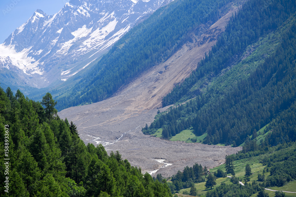 Fototapeta premium Rockfall in the Swiss Alps at Lötschental Valley covering almost hole mountain village of Blatten on a sunny late spring day. Photo taken June 19th, 2025, Lötschental, Switzerland.