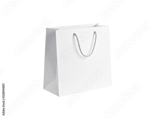 Minimalist white paper shopping bag with grey braided rope handles standing empty.