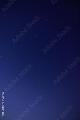 Starry Night Sky with a Deep Blue Gradient

