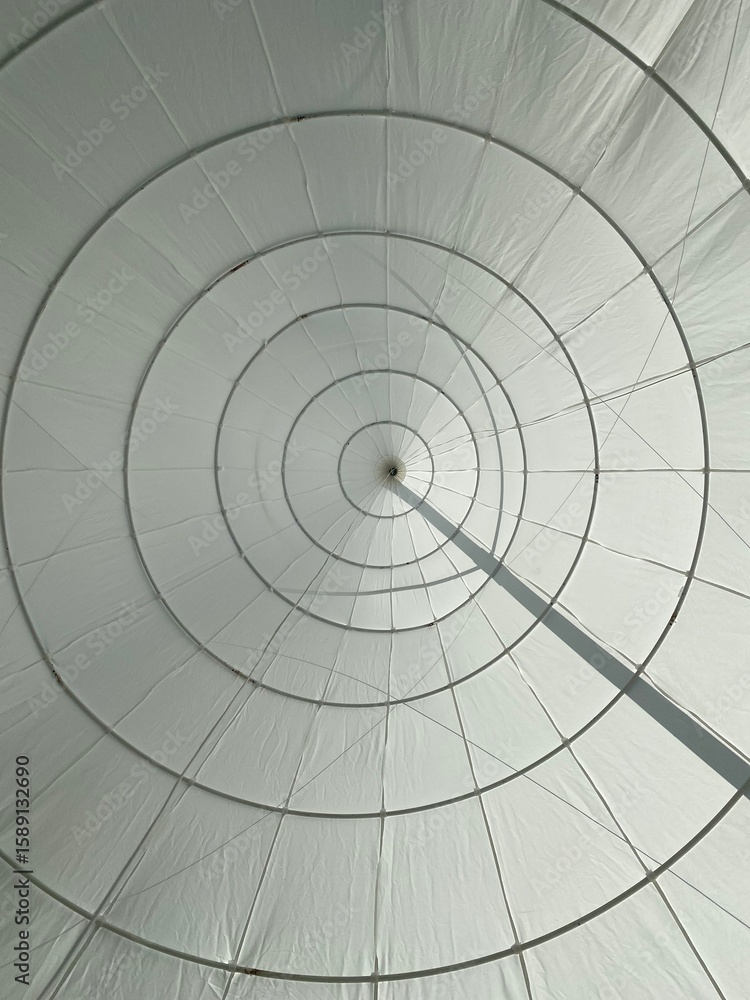 Fototapeta premium Geometric Spiral Structure in White Fabric with Circular Lines