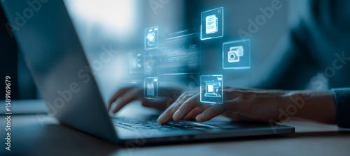 Person types on laptop with glowing data icons. Digitalization concept for business, web, marketing, design.