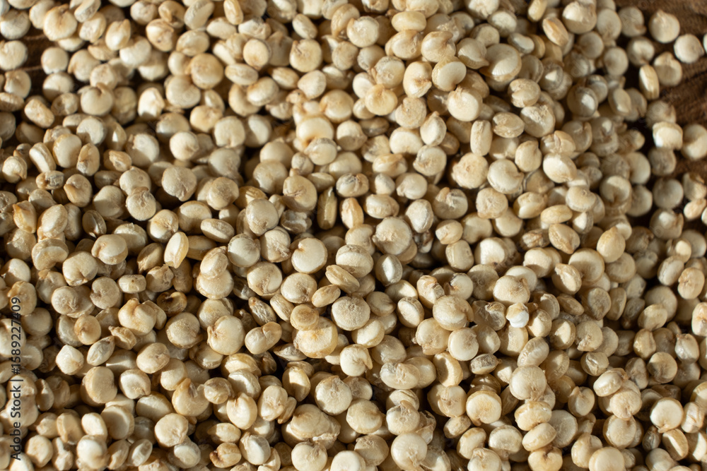 Fototapeta premium Top View of Dry White Quinoa Seeds. Natural Organic Surface.