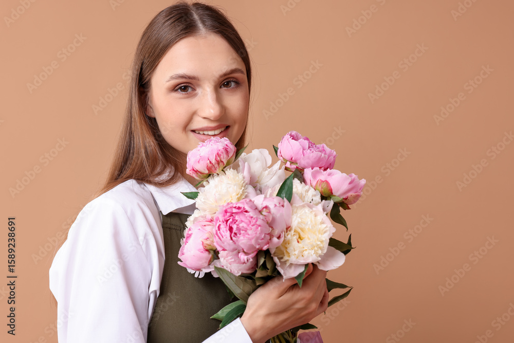 Florist with beautiful bouquet of peonies on dark beige background, space for text Florist with beautiful bouquet of peonies on dark beige background, space for text