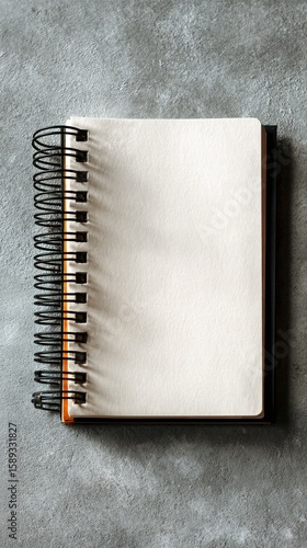 Open Spiral Notebook With Blank Pages Ready for Creative Thoughts and Sketches.