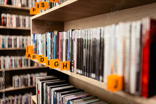 Books, audiobooks, radio dramas, and films on a shelf in a library. School readings. School and university library