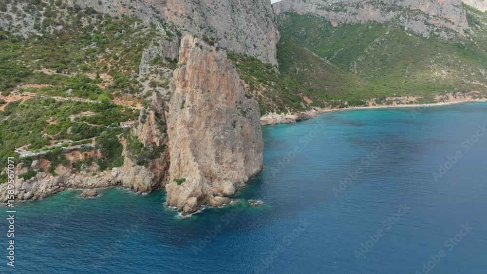 Pedra Longa Monolith emerging from the crystalline Sardinian sea Pedra Longa Monolith emerging from the crystalline Sardinian sea