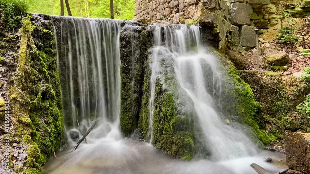Obraz premium Fragment of Diabelski Most bridge and waterfall in Dolina Eliaszowki, Lesser Poland Voivodeship, Krakow, Poland. Nature, hiking, Polish landscape, travel destination, scenic forest, outdoor adventure.