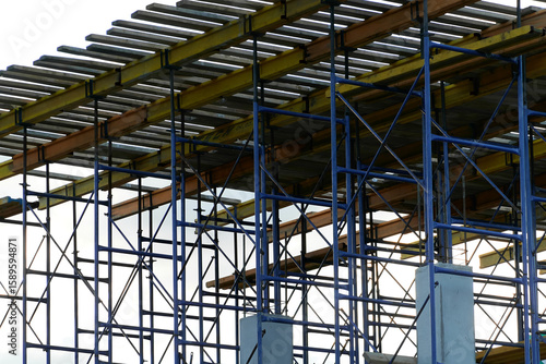 building concrete structures with rebar against the background of the sunset sky. background. blank for the designer. for an article about construction or building infrastructure