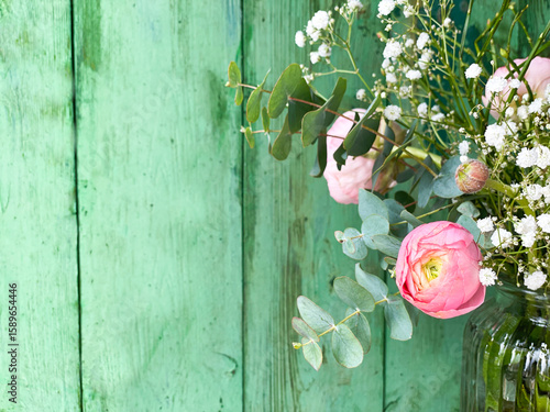 spring flowers on wooden ba...