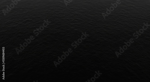 Close up abstract background texture of dark rough surface with fine grain detail