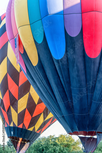 Two hot air balloons with the American flag on one of them