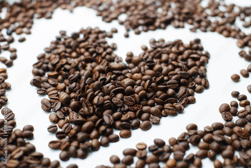 Perfectly roasted coffee beans on a white background. Coffee. Perfectly roasted coffee beans on a white background. Coffee.