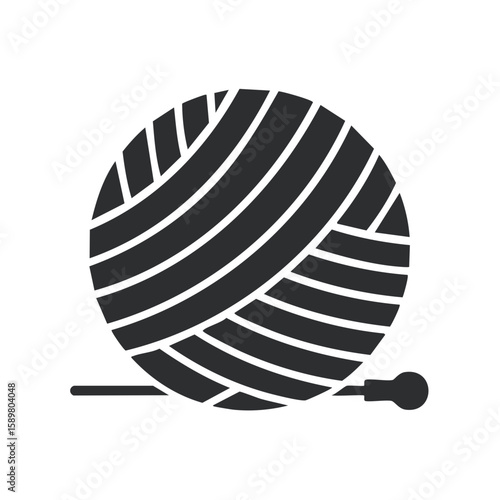 Cozy Crafting Concept A dark toned ball of yarn rests alongside a knitting needle perfect for textile creations