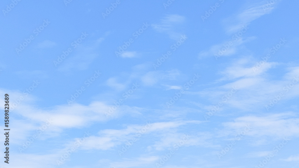 Fototapeta premium Clear blue sky with soft cloud with daylight natural background. Soft white clouds float in the clear blue sky. Clear blue sky, bright spring, soft sky gradient.