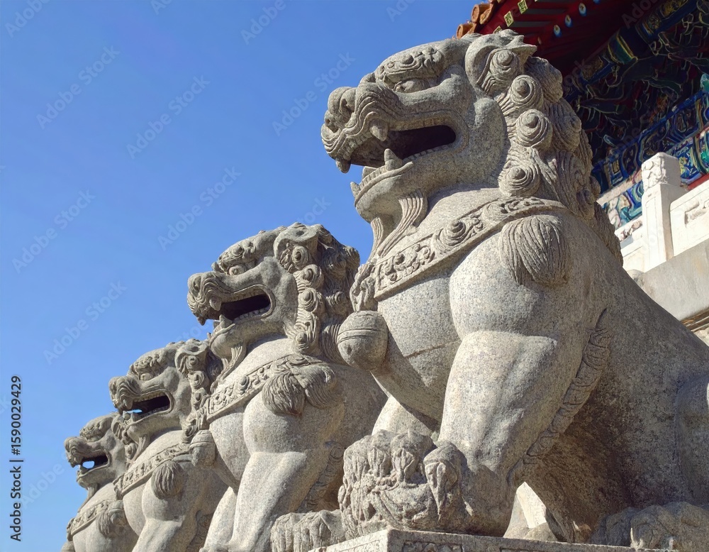 Obraz premium Ancient stone lions guard a temple