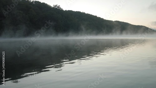 low hanging mist over water