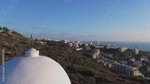  Aerial view moving around the cross of Stella Maris chapel monastery ,Haifa,video footage (circle mode)